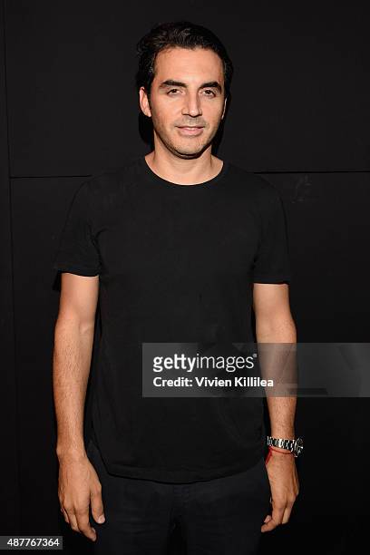 Designer Yigal Azrouel poses backstage at the Yigal Azrouel fashion show during Spring 2016 New York Fashion Week: The Shows at The Dock, Skylight at...