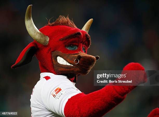 Leipzig mascot Bulli celebrates with his fans after winning the Second Bundesliga match between RB Leipzig and SC Paderborn at Red Bull Arena on...