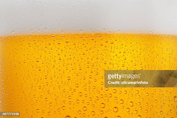 beer background   ice cold  glass covered with water drops  condensation - oktoberfest stockfoto's en -beelden