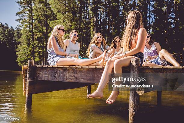 friends on a jetty - party on the pier stock pictures, royalty-free photos & images