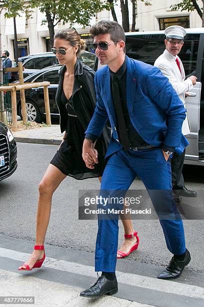 Singer Robin Thicke and girlfriend April Love Geary arrive at the 'Plaza Athenee' hotel on September 11, 2015 in Paris, France.