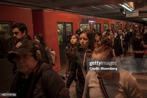 Commuters walk on the platform at the Tacuba Metro station in Mexico City, Mexico, on Tuesday, Sept. 8, 2015. Mexico City has the second-largest...