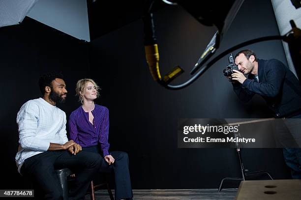 Donald Glover and Mackenzie Davis of 'The Martian' pose for a portrait with Jeff Vespa in the Guess Portrait Studio at the Toronto International Film...