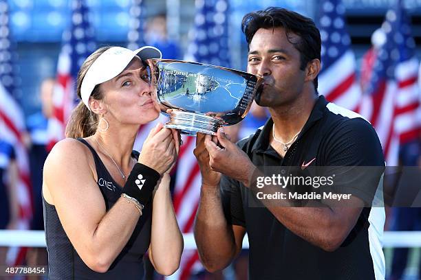 Martina Hingis of Switzerland and Leander Paes of India celebrate after defeating Bethanie Mattek-Sands of the United States and Sam Querrey of the...