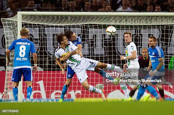 Roel Brouwers of Moenchengladbach is challenged by Albin Ekdal of Hamburg during the Bundesliga match between Borussia Moenchengladbach and Hamburger...