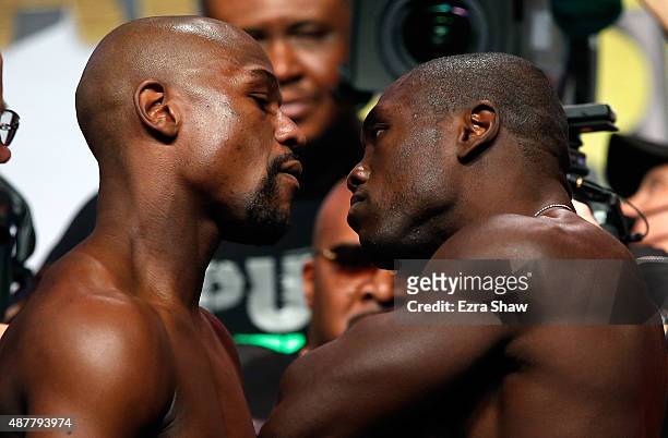 Boxers Floyd Mayweather Jr. And Andre Berto face off during their official weigh-in at MGM Grand Garden Arena on September 11, 2015 in Las Vegas,...