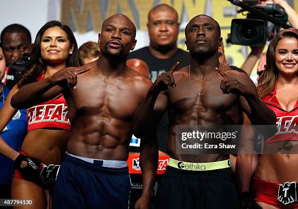 Boxers Floyd Mayweather Jr. And Andre Berto face off during their official weigh-in at MGM Grand Garden Arena on September 11, 2015 in Las Vegas,...