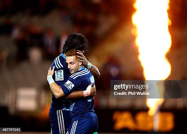 Ihaia West of the Blues is congratulated on his try during the round 12 Super Rugby match between the Blues and the Reds at Eden Park on May 2, 2014...