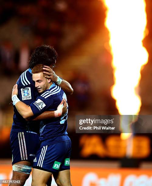 Ihaia West of the Blues is congratulated on his try during the round 12 Super Rugby match between the Blues and the Reds at Eden Park on May 2, 2014...