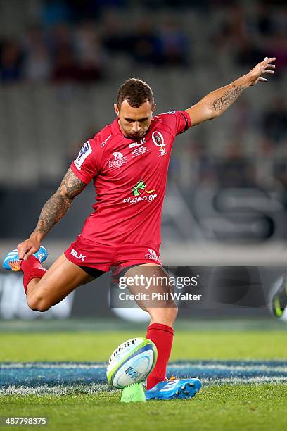 Quade Cooper of the Reds kicks during the round 12 Super Rugby match between the Blues and the Reds at Eden Park on May 2, 2014 in Auckland, New...