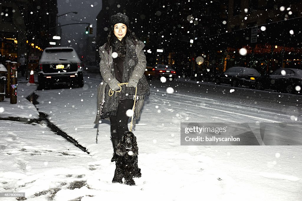 Woman and dog in snow