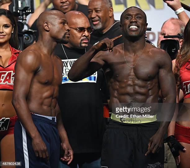 Floyd Mayweather Jr. Stares at Andre Berto as they pose during their official weigh-in at MGM Grand Garden Arena on September 11, 2015 in Las Vegas,...