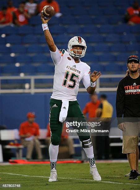 Brad Kaaya of the Miami Hurricanes warms up during the a game against the Florida Atlantic Owls at FAU Stadium on September 11, 2015 in Boca Raton,...