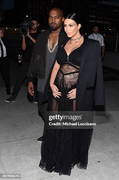 Rapper Kanye West and television personality Kim Kardashian attend the Givenchy fashion show during Spring 2016 New York Fashion Week at Pier 26 at...