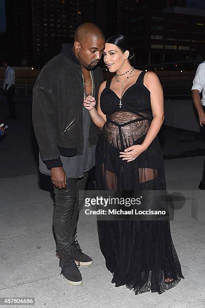 Rapper Kanye West and television personality Kim Kardashian attend the Givenchy fashion show during Spring 2016 New York Fashion Week at Pier 26 at...
