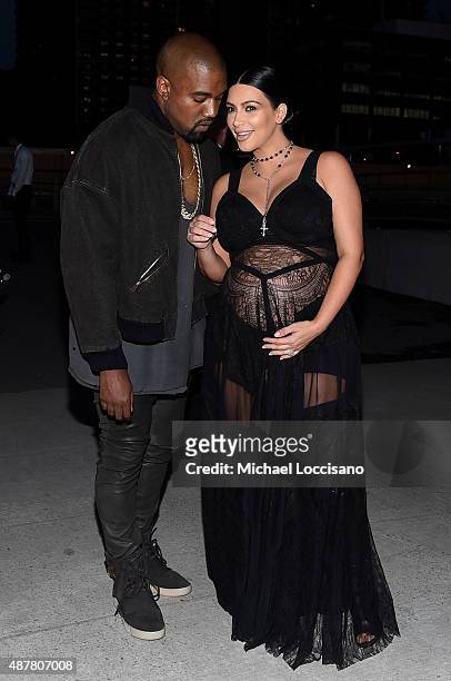 Rapper Kanye West and television personality Kim Kardashian attend the Givenchy fashion show during Spring 2016 New York Fashion Week at Pier 26 at...