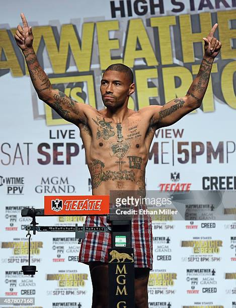 Boxer Ashley Theophane poses on the scale during his official weigh-in at MGM Grand Garden Arena on September 11, 2015 in Las Vegas, Nevada....