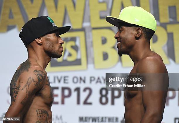 Boxers Ashley Theophane and Steven Upsher face off during their official weigh-in at MGM Grand Garden Arena on September 11, 2015 in Las Vegas,...