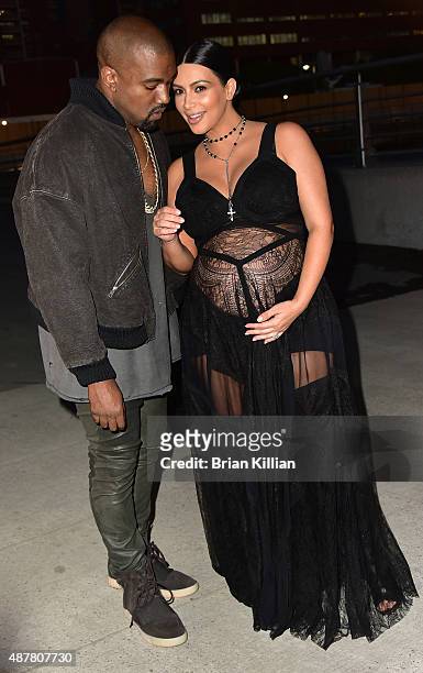Kanye West and Kim Kardashian attend the Givenchy show during Spring 2016 New York Fashion Week at Pier 26 on September 11, 2015 in New York City.