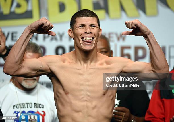 Boxer Roman Martinez poses on the scale during his official weigh-in at MGM Grand Garden Arena on September 11, 2015 in Las Vegas, Nevada. Martinez...