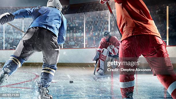 eishockey-spieler in aktion - ice hockey goaltender stock-fotos und bilder