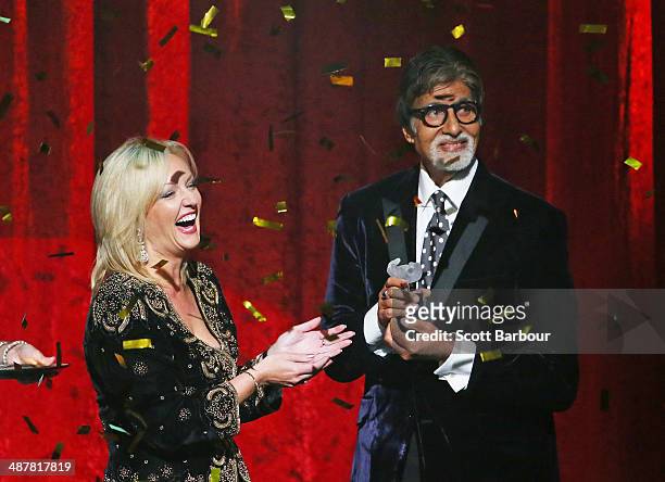 Member of the Victorian Legislative Assembly, Heidi Victoria presents Indian film actor, Amitabh Bachchan with the International Screen Icon Award...