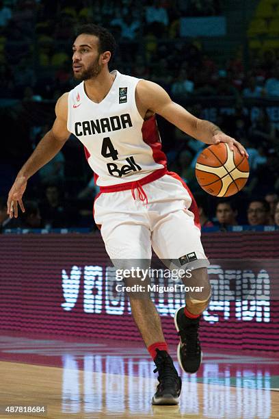 Philip Scrubb of Canada dribbles the ball during a semifinals match between Canada and Venezuela as part of the 2015 FIBA Americas Championship for...