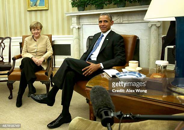 German Chancellor Angela Merkel meets with U.S. President Barack Obama in the Oval Office of the White House May 2, 2014 in Washington, DC. Obama and...