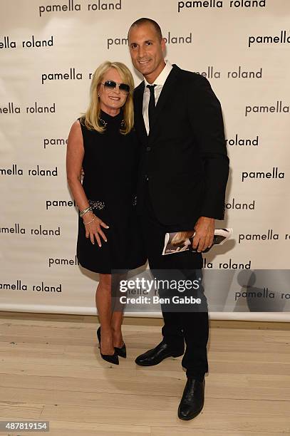 Designer Pamella Roland and photographer Nigel Barker pose backstage at the Pamella Roland Spring 2016 fashion show at The Whitney Museum of American...