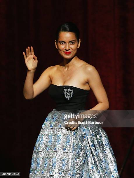 Indian actress, Kangana Ranaut gestures as she walks on stage to accept her award at the Indian Film Festival of Melbourne Awards at Princess Theatre...