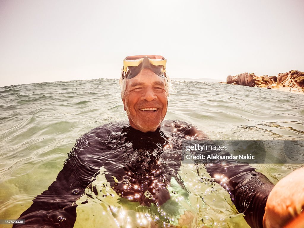 Snorkelling selfie of a senior man