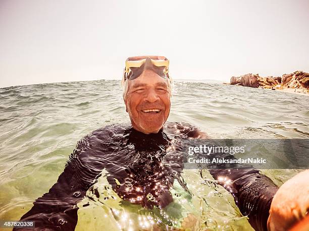 Snorkelling selfie of a senior man