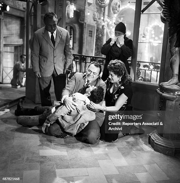 American actor Ernest Borgnine and Greek-born Italian actress Yvonne Sanson greiving over French actor Max Cartier in the film The King of...