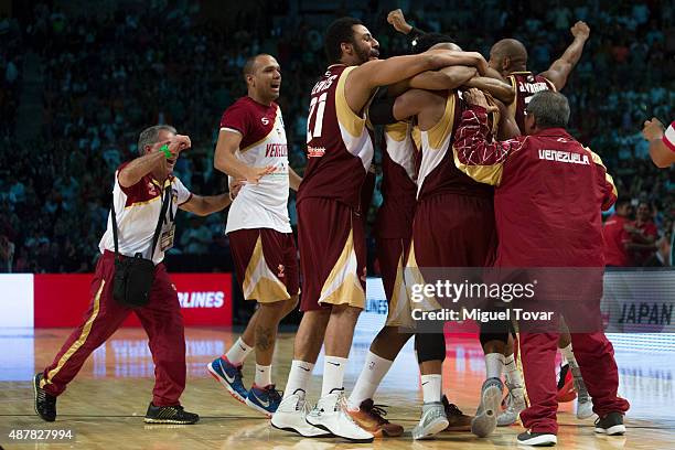 Players of Venezuela celebrate after winning a semifinals match between Canada and Venezuela as part of the 2015 FIBA Americas Championship for Men...