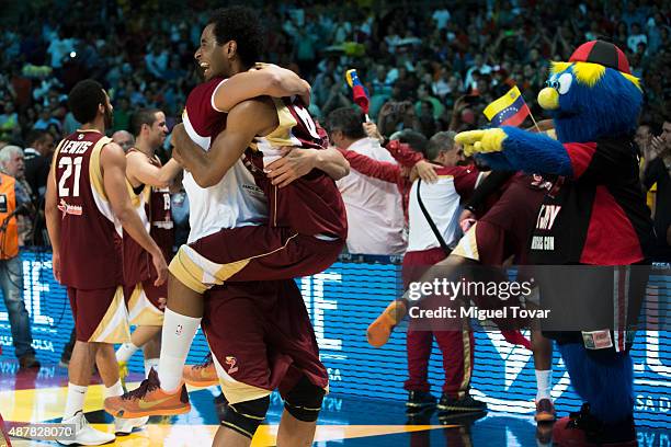 Players of Venezuela celebrate after winning a semifinals match between Canada and Venezuela as part of the 2015 FIBA Americas Championship for Men...