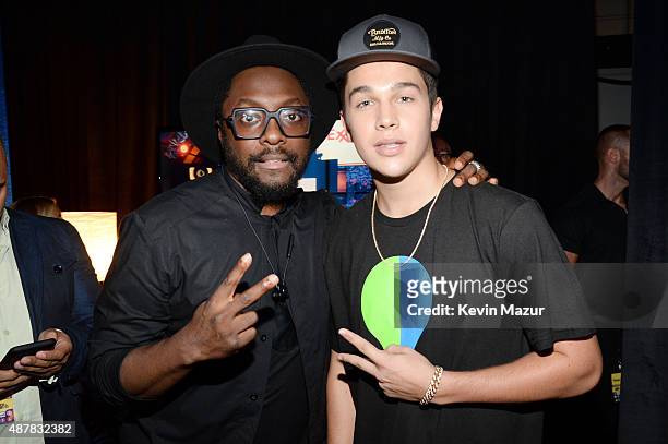 Recording artists will.i.am and Austin Mahone attend the Think It Up education initiative telecast for teachers and students, hosted by Entertainment...