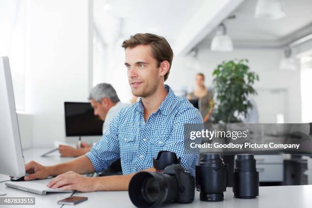 doing the final retouching on his photos - average photo editing by professional photographers stock pictures, royalty-free photos & images