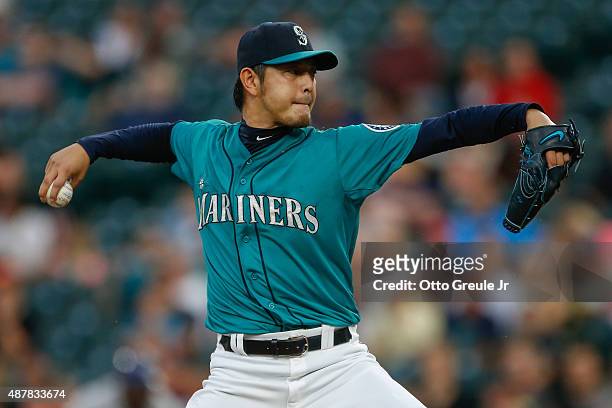 Starting pitcher Hisashi Iwakuma of the Seattle Mariners pitches against the Colorado Rockies in the first inning at Safeco Field on September 11,...