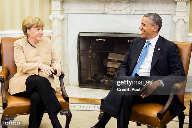 German Chancellor Angela Merkel and U.S. President Barack Obama hold a bilateral meeting in the Oval Office at the White House on May 2, 2014 in...