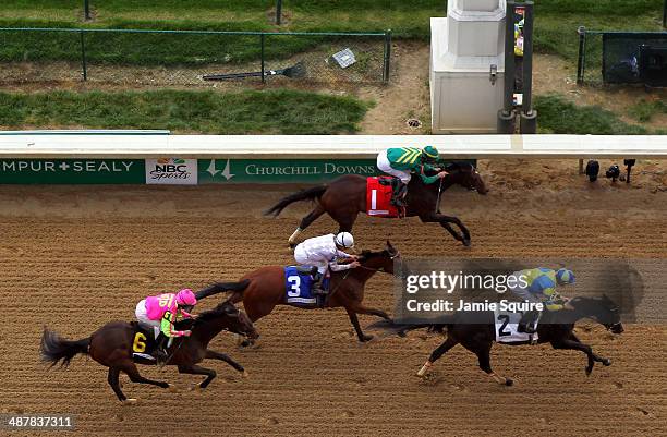 Tiz Windy leads Handmade and Flipcup across the finish line to win the 3rd race ahead of the 140th Kentucky Oaks at Churchill Downs on May 2, 2014 in...