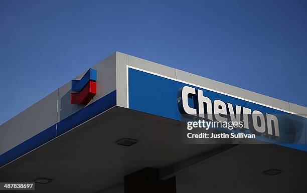 The Chevron logo is displayed at a Chevron gas station on May 2, 2014 in Greenbrae, California. Chevron Corp. Reported a 27 percent plunge in first...