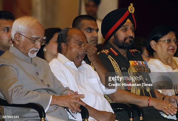Vice President Hamid Ansari, Defence Minister AK Antony and Army chief General Bikram Singh along with his wife during a Defence Investiture Ceremony...