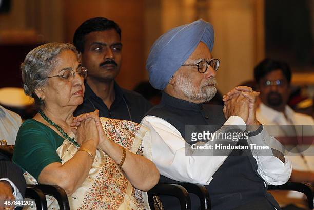 Prime Minister Manmohan Singh with a wife Gursharan Kaur during a Defence Investiture Ceremony at Rashtrapati Bhawan on May 2, 2014 in New Delhi,...