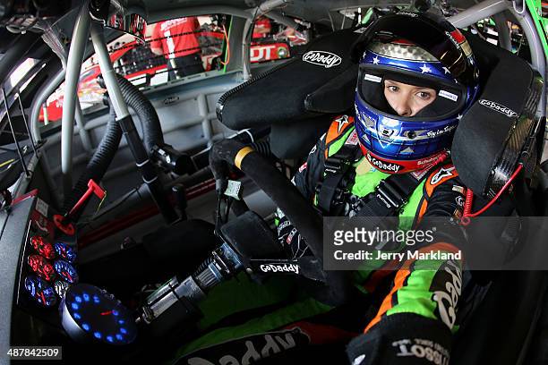 Danica Patrick, driver of the GoDaddy.com Chevrolet, sits in her car during practice for the NASCAR Sprint Cup Series Aaron's 499 at Talladega...