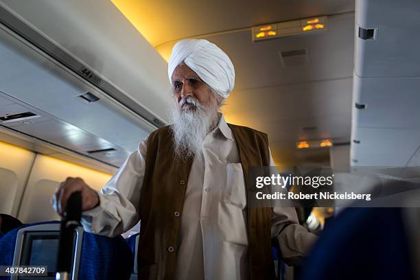 Sikh man walks to his seat for a Virgin Atlantic flight to New Delhi February 19, 2014 at Heathrow International Airport in London, England.