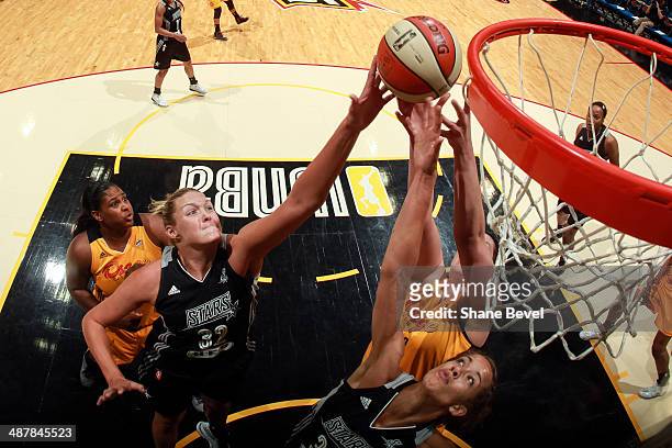 Jayne Appel and Jessica Kuester of the San Antonio Stars battle for a rebound with Courtney Paris and Amber Dvorak of the Tulsa Shock during the WNBA...