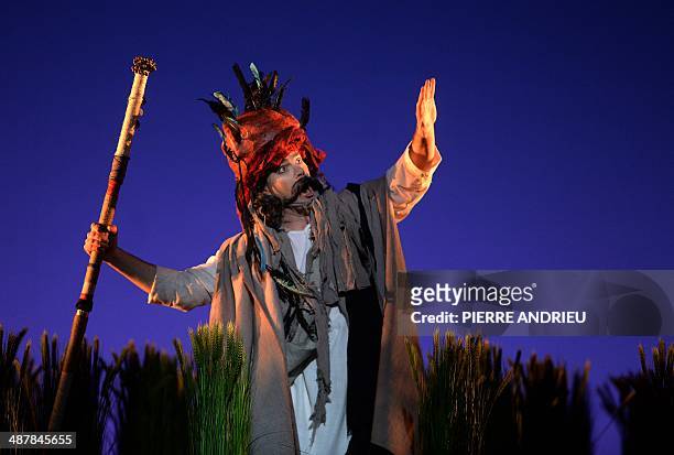 Baritone Franco Pomponi performs during a full dress rehearsal of the Opera "A Flowering Tree" at the Chatelet theater on May 2, 2014 in Paris. The...