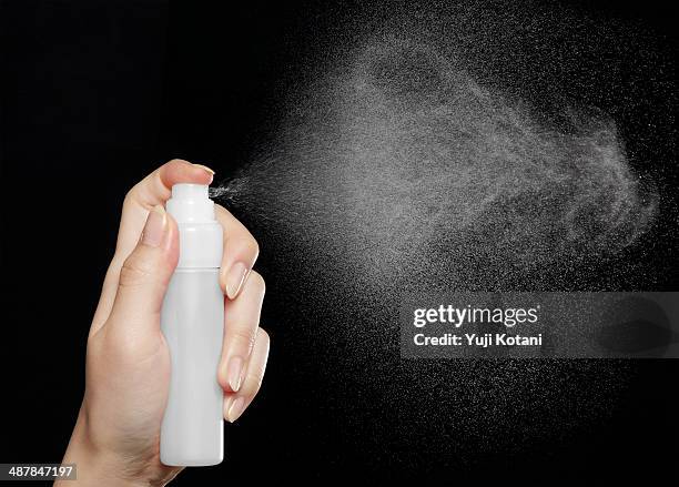 spray - spray on hand stock pictures, royalty-free photos & images