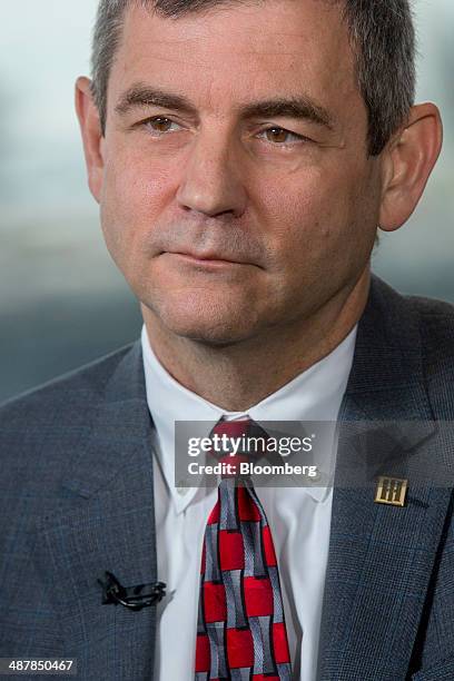 Michael "Mike" Petters, president and chief executive officer of Huntington Ingalls Industries Inc., listens during a Bloomberg Television interview...