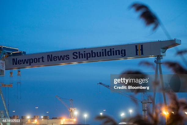 Crane stands over the Huntington Ingalls Industries' Newport News Shipbuilding shipyard in Newport News, Virginia, U.S., on Sunday, April 27, 2014....